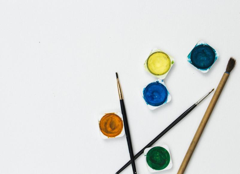 Paints and brushes on a white background